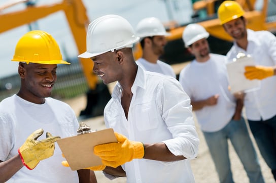 osha safety check list Happy architects working at a construction site outdoors