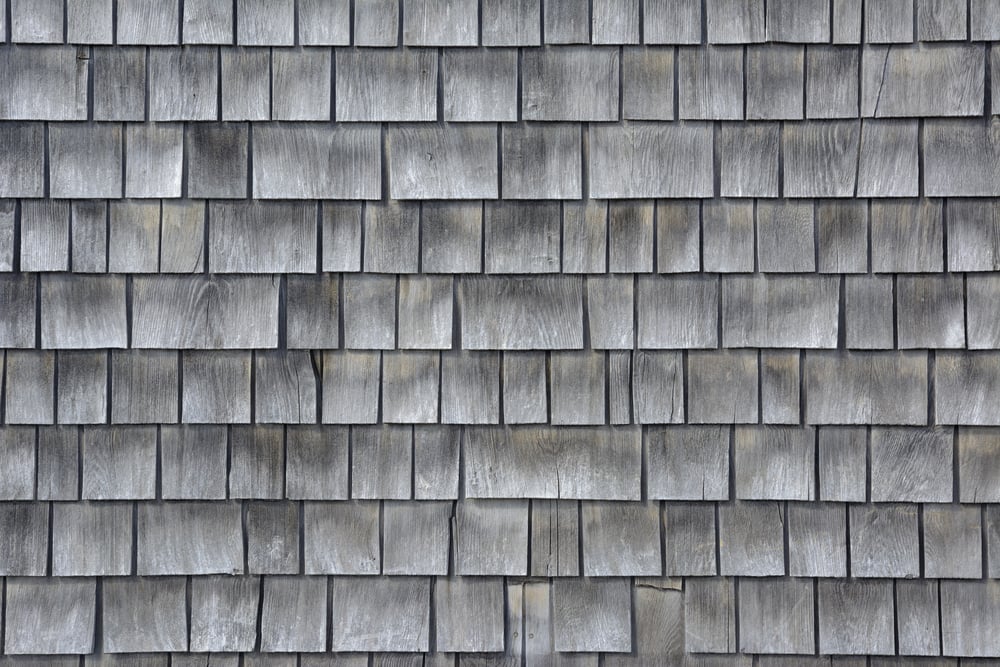 Siding of gray wood shingles with low environmental impact on house in Cape Cod, Massachusetts