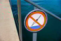 no-jumping-into-the-water-sign-2023-11-27-04-58-30-utc
